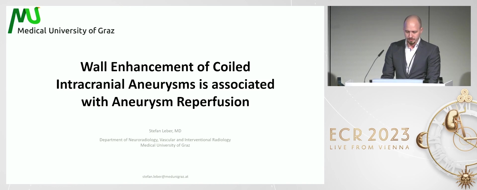 Aneurysm wall enhancement of coiled intracranial aneurysms is associated with aneurysm remnants